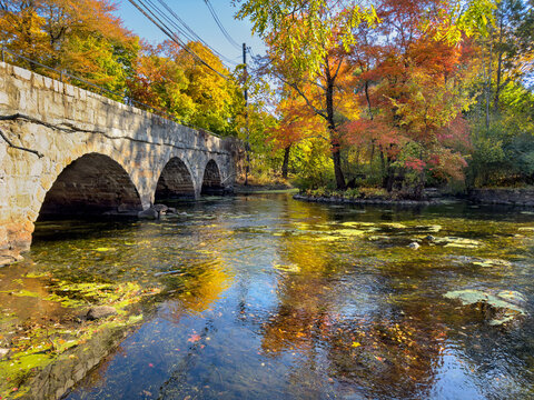 Exceptionally low water levels on the Charles River, Natick, Massachusetts, on a sunny Autumn afternoon