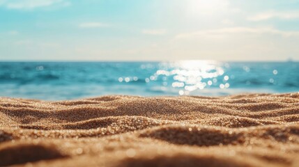 Plakat Close up of sand with a blurred background of sea and sky ideal for summer themes with space for product or text placement