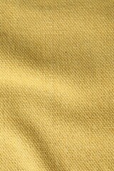 Texture of golden color fabric as background, top view