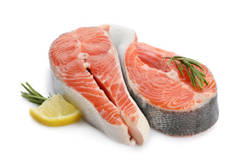 Two fresh salmon steaks, lemon and rosemary isolated on white