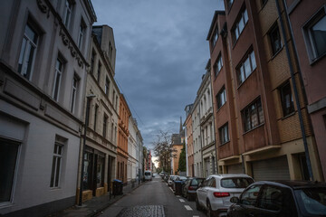 Selective blur on Residential street in Cologne city center with a mix of modern & older apartment...