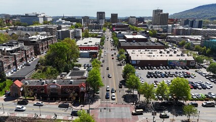 The downtown Chattanooga landscape extending to the mountains showcased from a drone angle