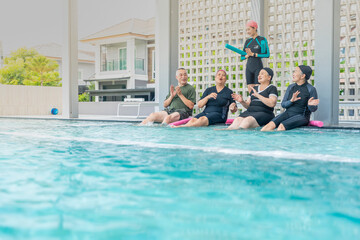 A group of seniors enjoys a lively water exercise class, led by an instructor at a poolside. They splash, laugh, and engage in fun activities, staying active and promoting health and wellness.