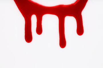 Stain of blood on white background, top view