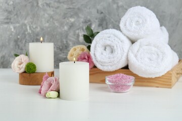 Composition with different spa supplies on white table