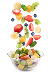 Tasty fruit salad. Fresh ingredients falling into bowl on white background