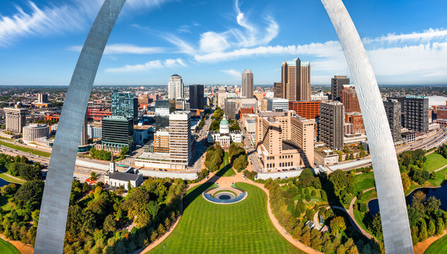 Aerial panorama of St. Louis, Missouri skyline on a sunny day, in front of the Gateway Arch park. St. Louis is an independent city in the U.S. state of Missouri.