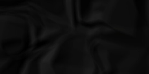 Crumpled texture of dark black wrinkle chaotic paper. old crumple black old paper sheet abstract shape recycling wrapping background space for texture.