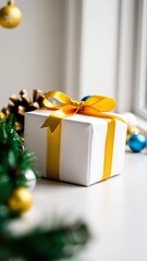 white gift box decorated with a yellow bow