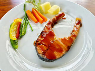 Salmon stake on wooden table
