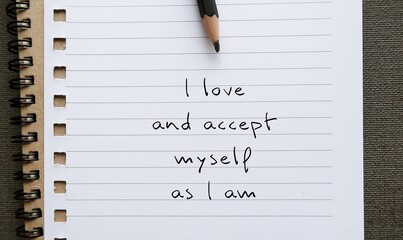Notebook with pencil writing message - I accept and love myself as I am - concept of self-love and...