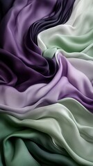 Fototapeta premium A beautiful arrangement of silky, flowing fabrics in shades of green, purple, and white, creating a sense of elegance and tranquility.