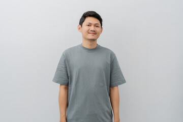 Happy expression of adult Asian man with casual t-shirt isolated on white background