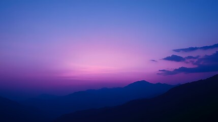 Fototapeta premium A beautiful sky at twilight with deep blue and purple tones as the last light of day fades away