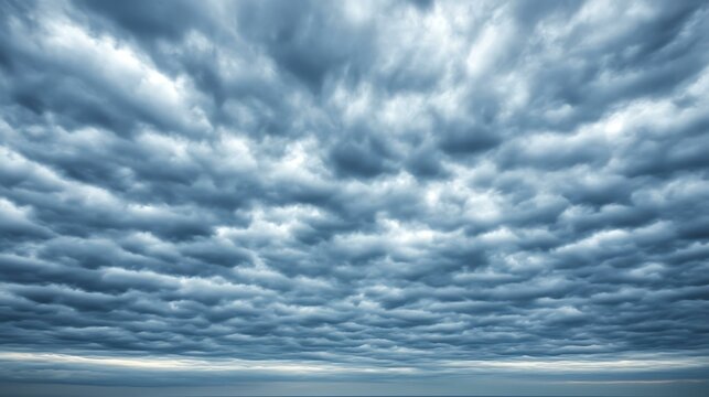 A sky covered in stratus clouds, creating a smooth, overcast look on a cool, cloudy day