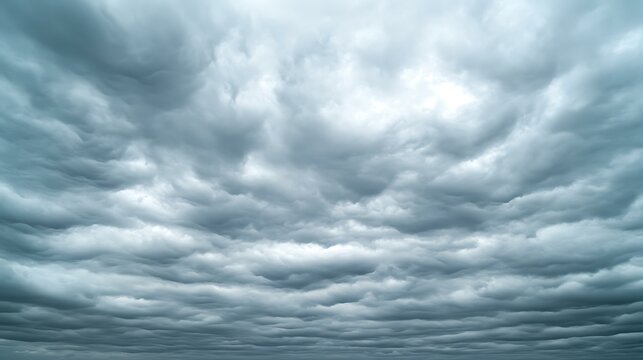 A sky covered in stratus clouds, creating a smooth, overcast look on a cool, cloudy day