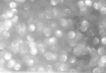 Background grey bokeh abstarct white beige circle light texture bubble blur pattern defocused glowing sparkle snow glitter snowflake magig backdrop ecosystem foreground card silver space decoration.