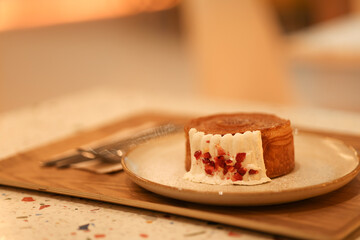 Croissants decorated with cream on a plate. Croissants decorated with cream with blurred background.
