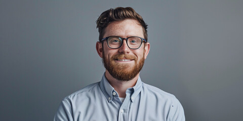 Smiling Young Man with Glasses in a Professional Setting