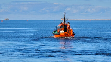 Fototapeta premium A pilot boat goes to meet a ship.