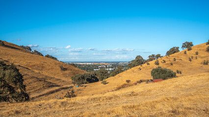 landscape in the mountains, city, blue sky  and the valley 