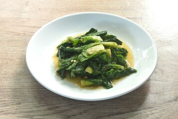 fried Brussels sprout or baby cabbage with soy sauce vegetarian food on plate 