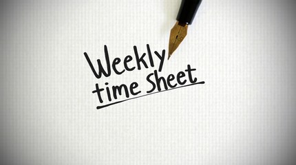 Weekly time sheet with fountain pen on paper