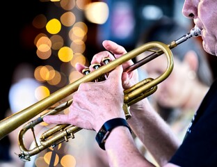 A trumpet player with low bokeh in the background © Sean