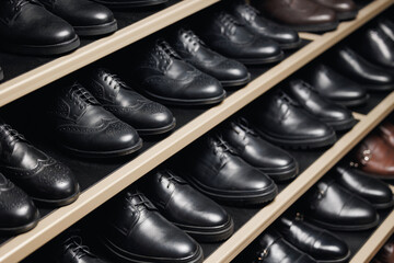 Fashion leather mens shoes in store, dark background