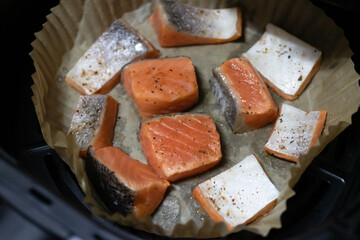 Air fryer lemon pepper salmon in parchment paper. Tasty cooked salmon steak, healthy and easy meals.
