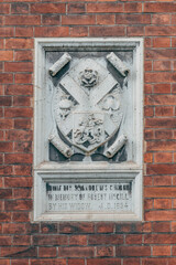 A plaque on the wall of the house of the chaplain of St. Andrew's Cathedral in Moscow