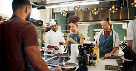Cooking, course or chef teaching woman in kitchen for knife skills, cutting technique or learning...