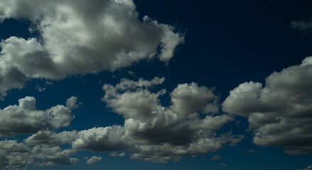 Blue Heaven and white clouds. Sky (clouds) background. White cloudy on Heaven with soft sun light. Clouds on pastel blue sky background. Sky Landscape Background. Sky Clouds Wallpaper.