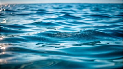 Fototapeta premium Sunlight glimmers on a wavy water surface, creating a serene and reflective natural scene.