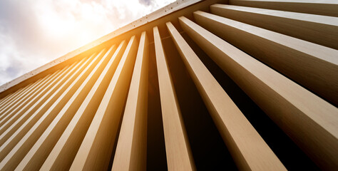 Obraz premium A structure featuring wooden slats on construction site contributing to its architectural style