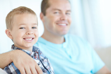 Portrait, father and son relax at house for safety, bonding together and love of relationship care. Happy, man and child with calm morning, weekend break and family support for embracing at apartment