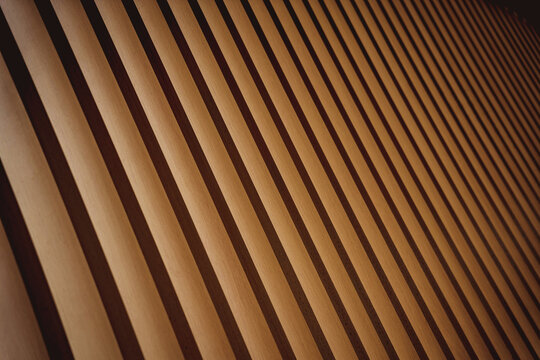 A structure featuring wooden slats on construction site contributing to its architectural style