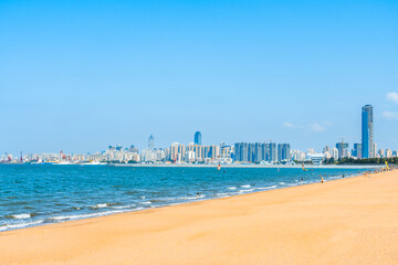 Obraz premium Scenery of Holiday Beach and West Coast Tall Buildings in Haikou, Hainan, China