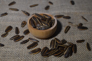 Sunflower seeds in wooden bowl