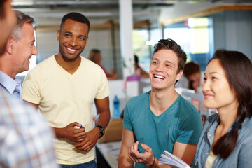 Employees, talking and office for feedback with project, brainstorming and support with proposal. Teamwork, laughing and collaboration in internship at workplace, funny conversation and creative plan