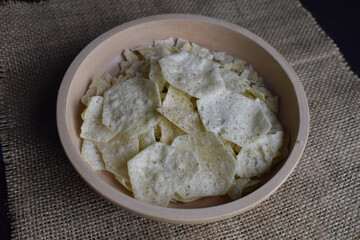 Potato chips in a wooden bowl