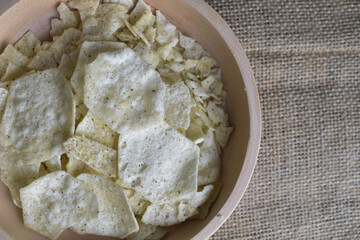 Potato chips in a wooden bowl