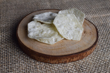 Potato chips on wood chips