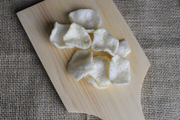 cracker snacks on wooden cutting board