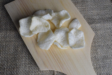cracker snacks on wooden cutting board