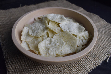 Potato chips in a wooden bowl