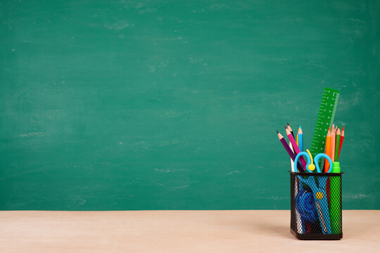 School supplies on desk background