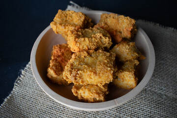 crispy tofu in a wooden bowl