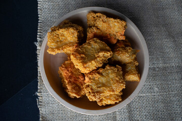 crispy tofu in a wooden bowl