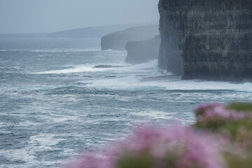 Waves crash into cliffs near Birsay, Orkney, Scotland